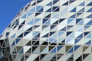 The glass facade of the Port House in Antwerp